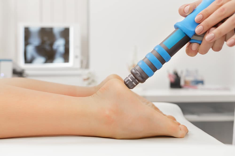 Patient’s foot as doctor administers EPAT for chronic heel pain.